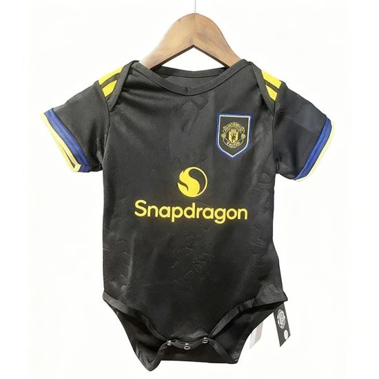 Black baby onesie featuring a yellow Snapdragon logo, a blue-and-gold team crest on the chest, and yellow-blue sleeve accents, hanging on a hanger with tags attached.