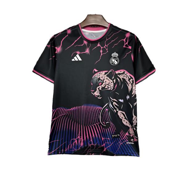 Black Real Madrid jersey with pink tiger graphic, lightning accents, and club crest; athletic-cut sportswear for football fans.