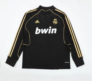 Black Real Madrid goalkeeper jersey with gold piping, Adidas logo, club crest, and 'bwin' sponsor on chest.