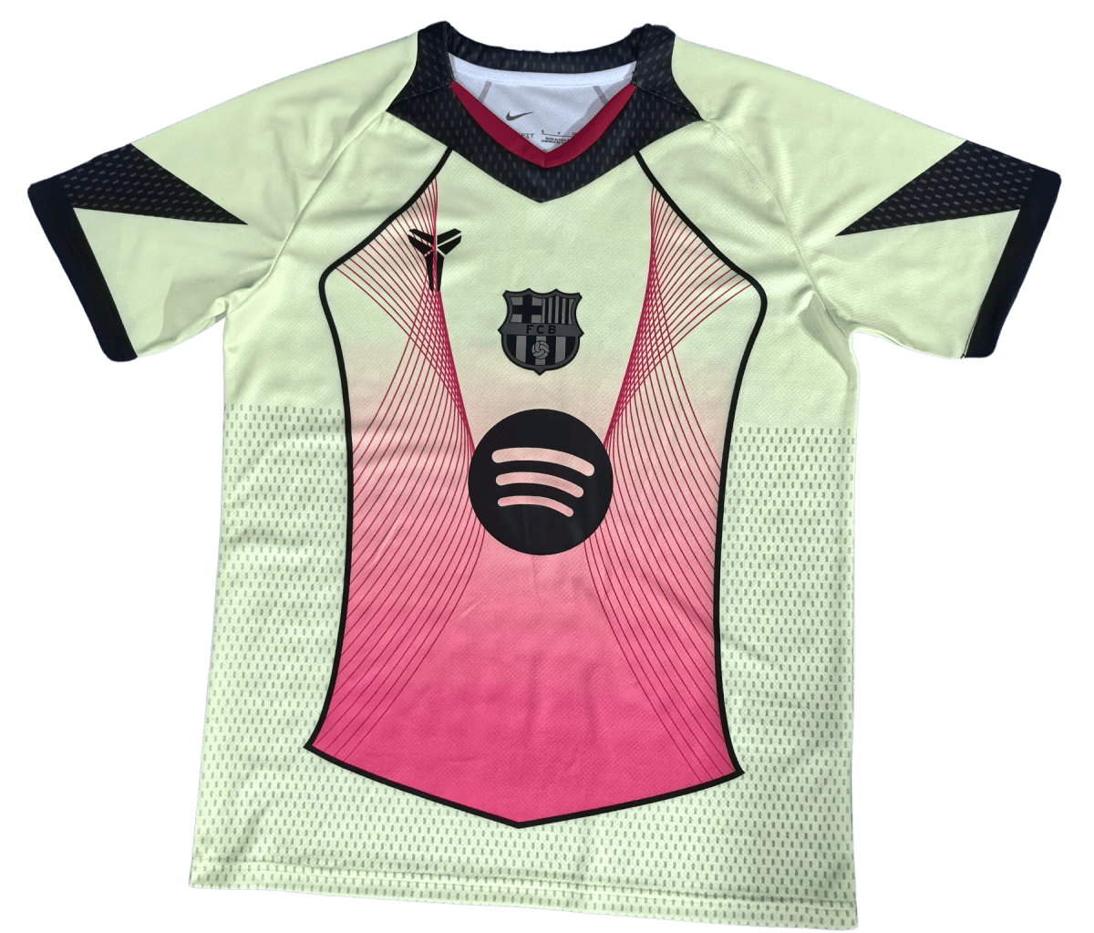 Light green soccer jersey with pink front panel, dark trim, and Spotify logo; FCB crest near the chest area.