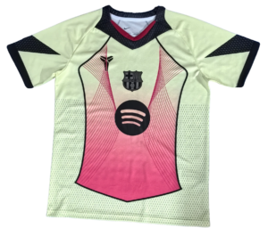 Light green soccer jersey with pink front panel, dark trim, and Spotify logo; FCB crest near the chest area.