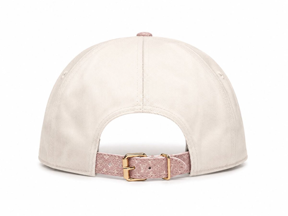 Back view of a beige baseball cap with a pink textured strap and gold buckle