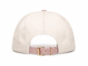Back view of a beige baseball cap with a pink textured strap and gold buckle