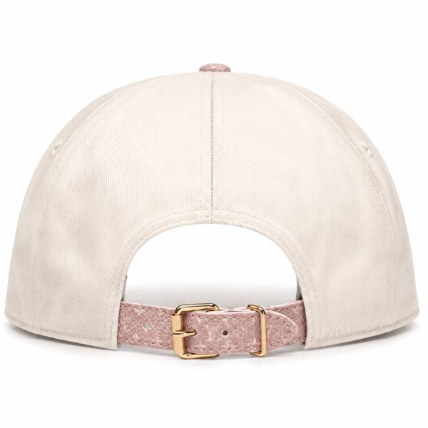 Back view of a beige baseball cap with a pink textured strap and gold buckle