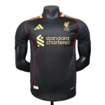 Liverpool FC away jersey on a black mannequin, black with gold sponsor logos and red piping.