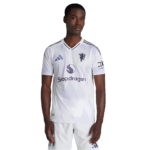 Front view of a man wearing a white soccer jersey with Snapdragon logo, standing with arms at his sides.