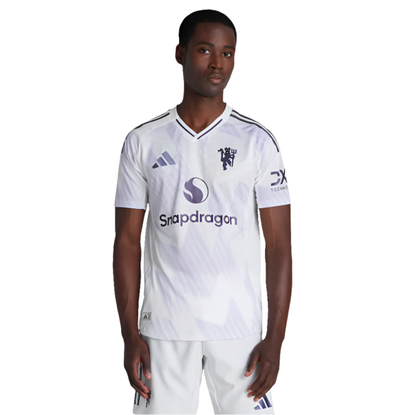 Front view of a man wearing a white soccer jersey with Snapdragon logo, standing with arms at his sides.