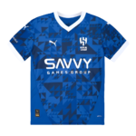 Blue geometric soccer jersey with white trim featuring the SAVVY Games Group logo and Puma branding on the chest area