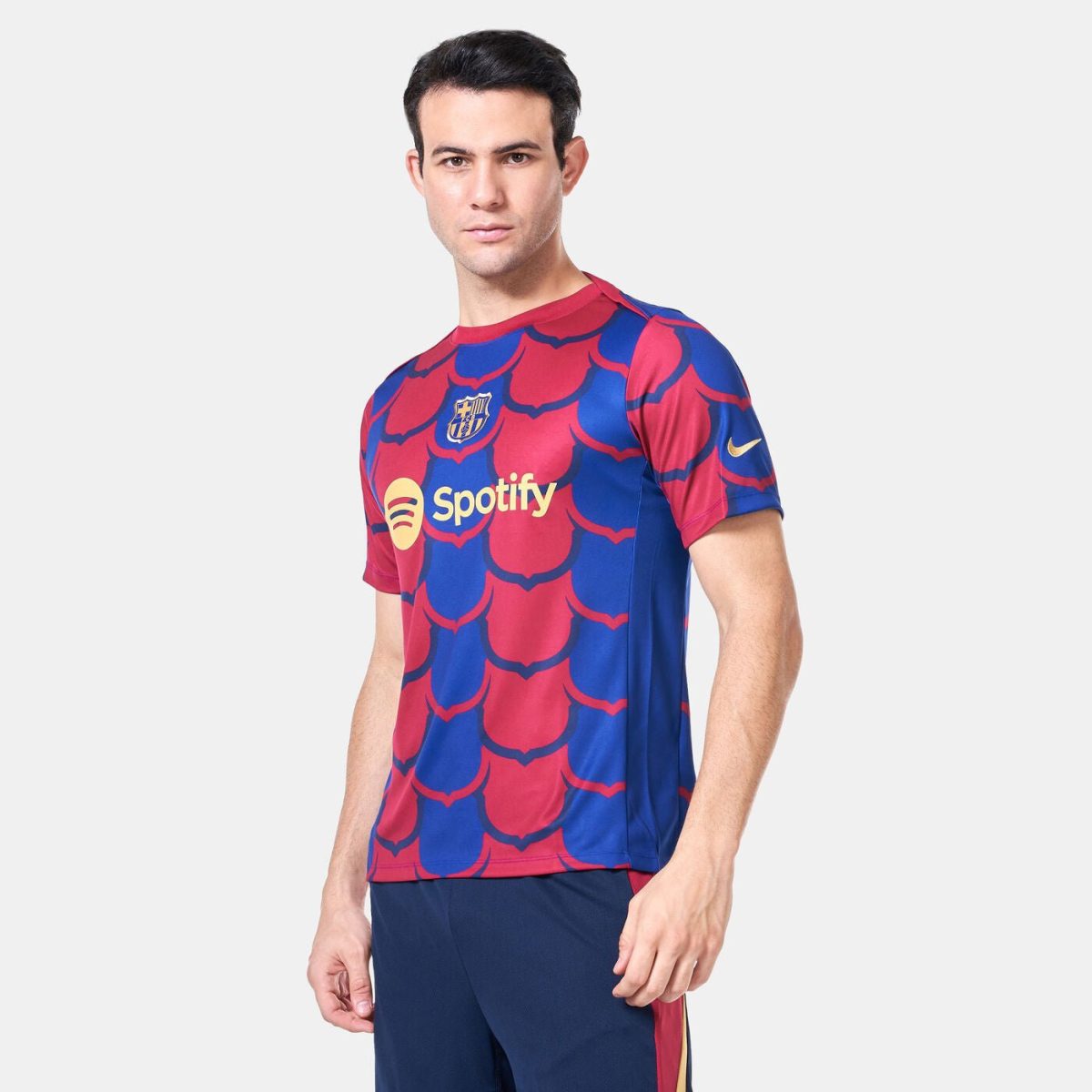 Male model wearing a red and blue FC Barcelona jersey with Spotify sponsor logo on the chest