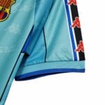 barcelona-away-classic-199697-jersey-with-ronldo-9-203184 | UAE SPORT STORE Close-up of a turquoise sports jacket sleeve with a patterned blue/black stripe and red Kappa logos along the side edge