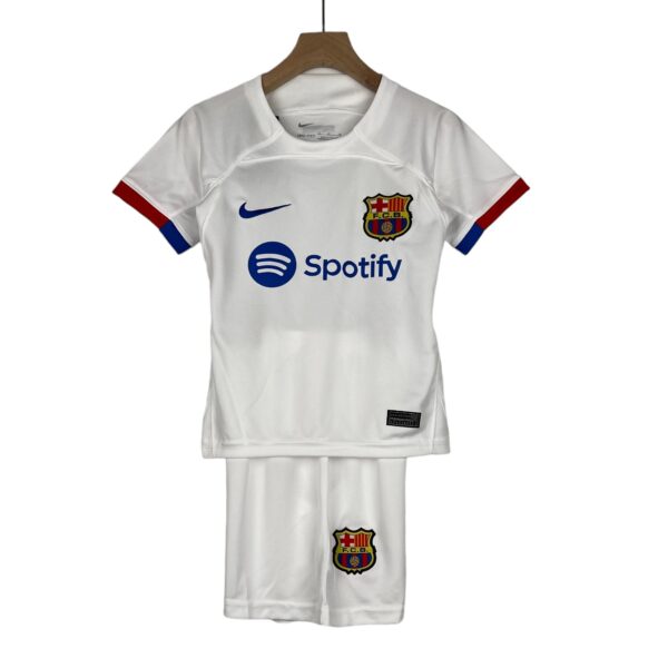 White FC Barcelona soccer jersey on a hanger with Nike swoosh, Spotify sponsor logo, and club crest visible on the chest.