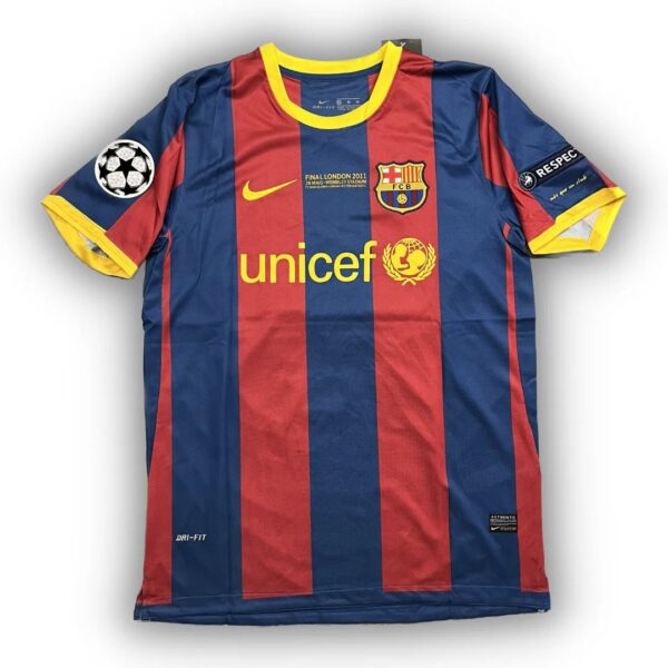 Barcelona FC jersey with UNICEF sponsor, blue and red vertical stripes, yellow Nike swoosh, club crest, and UEFA badge on the sleeve.