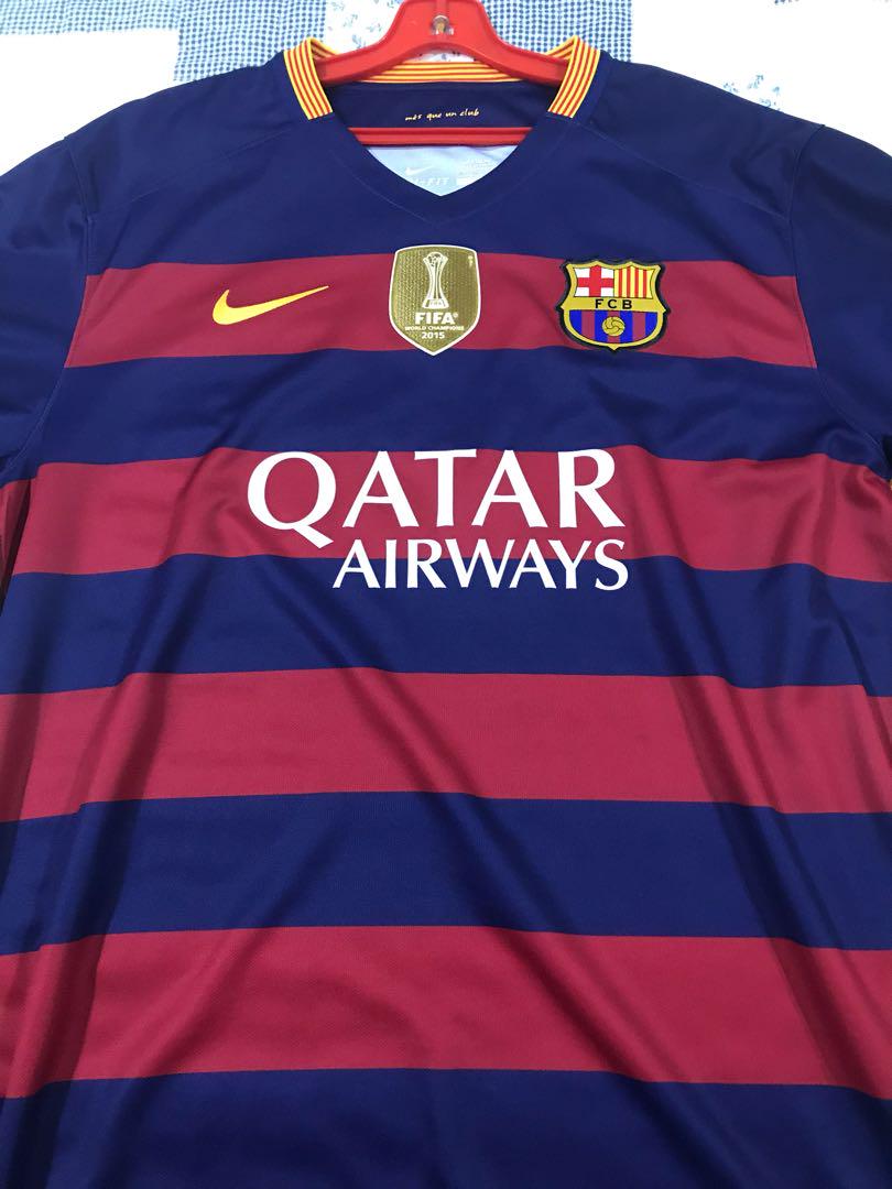 barcelona-classic-201516-final-with-messi-10-badges-jersey-348531 | UAE SPORT STORE FC Barcelona football jersey on a hanger: blue and maroon horizontal stripes, yellow Nike swoosh, Barça crest, FIFA badge, Qatar Airways sponsor.
