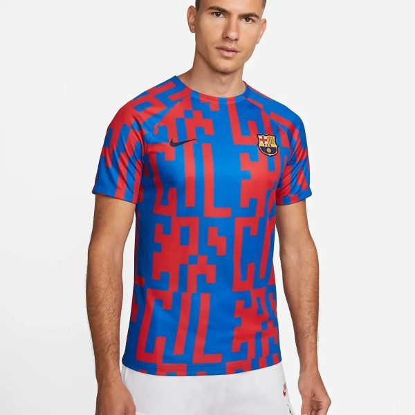 FC Barcelona football jersey in blue and red with a bold geometric pattern and the club crest on the chest.