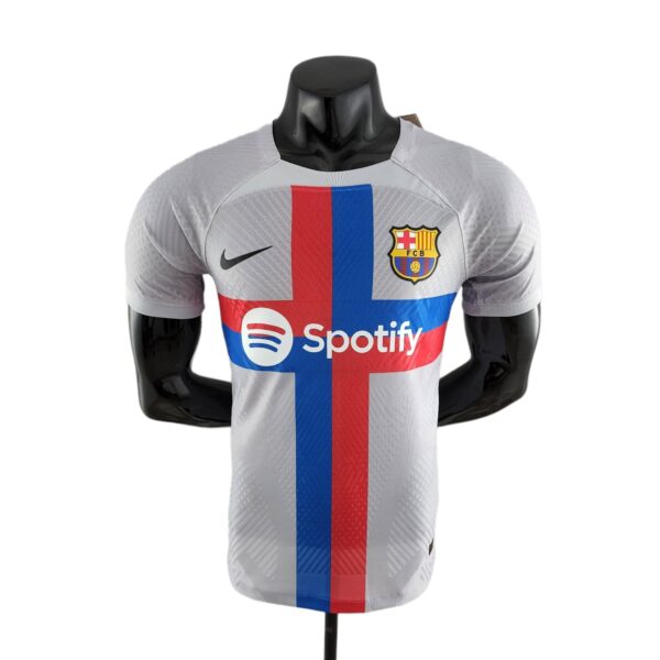 Mannequin wearing a Barcelona football jersey with Spotify sponsor and blue-red vertical stripe on the chest.
