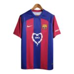 FC Barcelona soccer jersey on a wooden hanger with blue and red vertical stripes, Nike logo, and team crest on the chest.