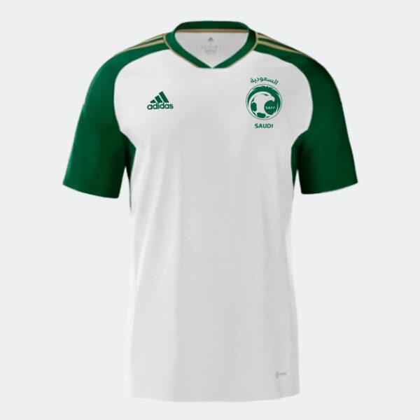 White soccer jersey with green sleeves and green collar trim, featuring Adidas logo on the left chest and SAFF Saudi crest on the right chest.