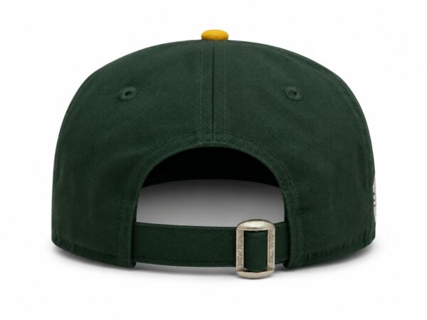 Classic green and gold sports cap with adjustable strap.