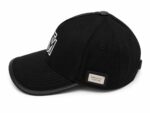Stylish black monogram cap with embroidered logo and adjustable strap. Perfect for sports and casual.