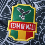 bc315183 | UAE SPORT STORE Embroidered patch logo with a green shield, yellow border, red band reading 'TEAM OF MALI', and an eagle holding a globe above.