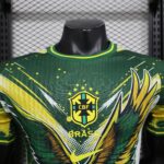 Close-up of a Brazil football jersey on a mannequin, green with yellow accents and the CBF crest, against a chain-link fence backdrop.