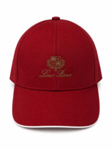 bc8ba14a-2c77-4ed6-b3f6-22f2df5fe6d4 | UAE SPORT STORE Red baseball cap with gold embroidered crest and 'Loro Piana' script on the front (front view).