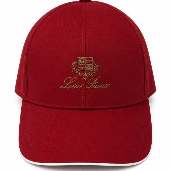 bc8ba14a-2c77-4ed6-b3f6-22f2df5fe6d4 - UAE SPORT STORE Red baseball cap with gold embroidered crest and 'Loro Piana' script on the front (front view).