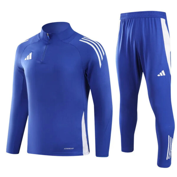 Blue athletic tracksuit top with a half-zip, white shoulder stripes, and matching blue pants with white accents.