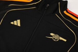 Black sports jacket with gold piping, Adidas logo on the left chest, and Arsenal crest featuring a cannon on the right chest.