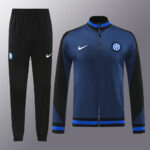 bf1c192d | UAE SPORT STORE Blue and black Inter Milan tracksuit jacket with matching black pants, featuring Nike swoosh and team crest on chest and leg.