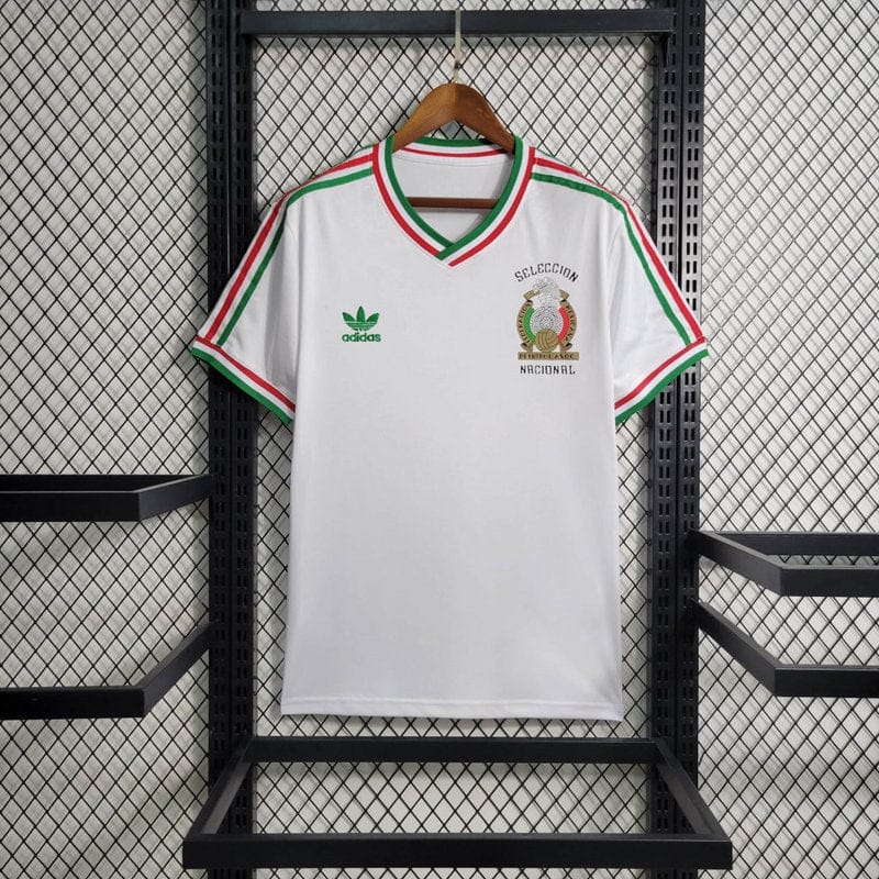 big-137_12f7e140-94a2-44d2-9f00-75ee954a534d | UAE SPORT STORE White Mexican national team polo-style jersey on a wooden hanger, Adidas logo on left chest and crest on right, green-red-green trim.