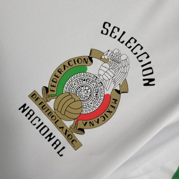 big-140-600x600_ce048828-ec6f-4c26-b728-51dd34c615a1 | UAE SPORT STORE Emblem of the Mexican Football Federation (Federación Mexicana de Fútbol Asociación) with eagle and circular green-white-red crest on white fabric.