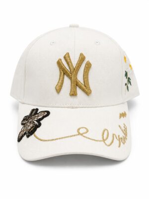 Yankees cap with gold embroidery and floral details, stylish accessory for sports fans.