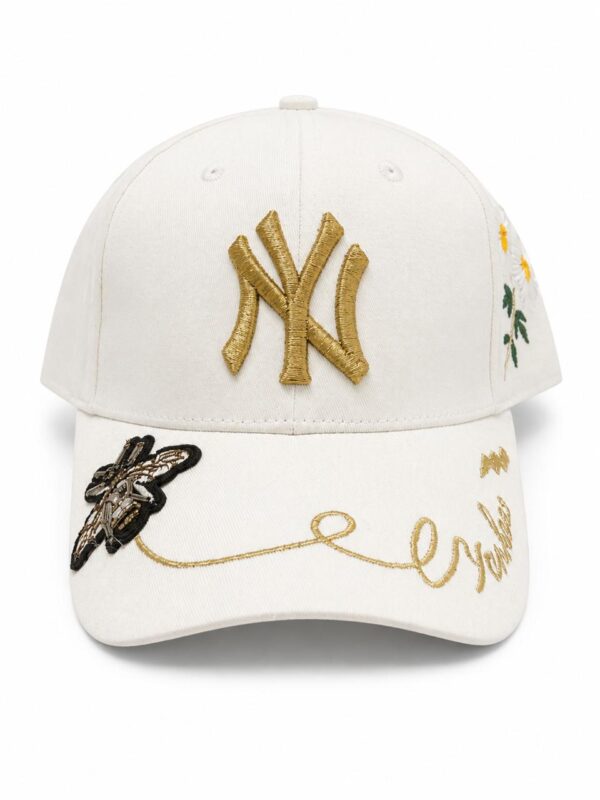 Yankees cap with gold embroidery and floral details, stylish accessory for sports fans.