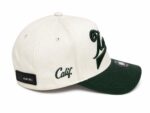 Cap with vintage script design and curved brim for streetwear style.