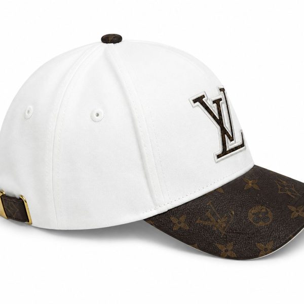 White baseball cap with a brown Louis Vuitton monogrammed brim and an LV logo on the front panel.