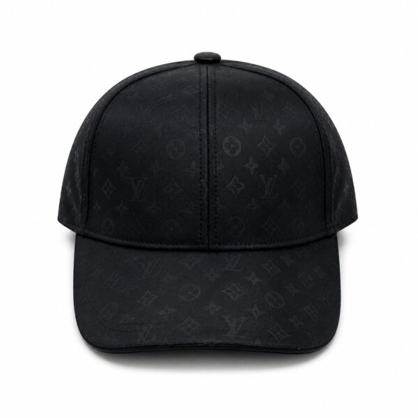 Black baseball cap with a subtle all-over Louis Vuitton monogram pattern, front view with curved brim.