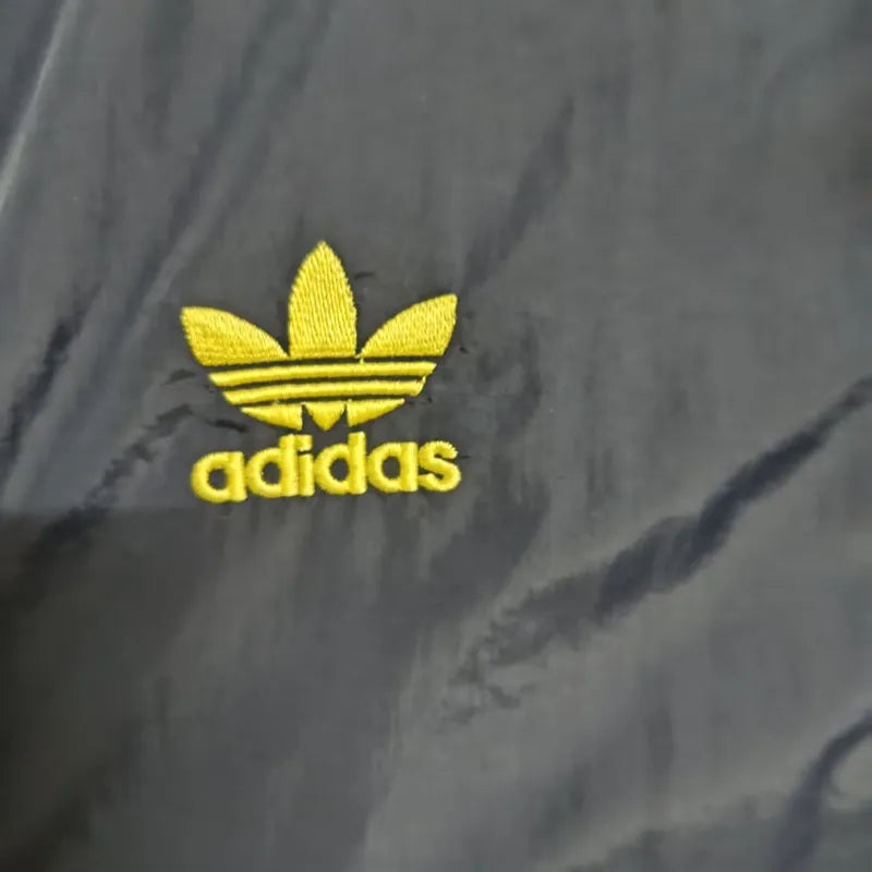 c6ddcc14e406523d | UAE SPORT STORE Yellow Adidas trefoil logo with 'adidas' text embroidered on dark fabric
