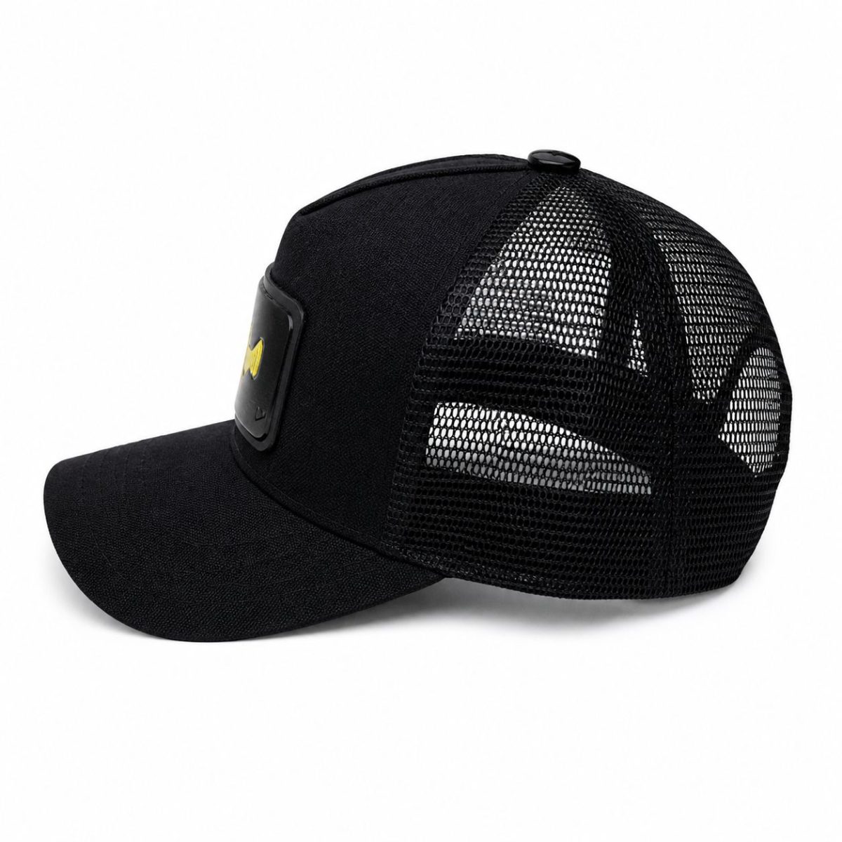 Black trucker cap with a Batman emblem patch on the front panel and a mesh back.