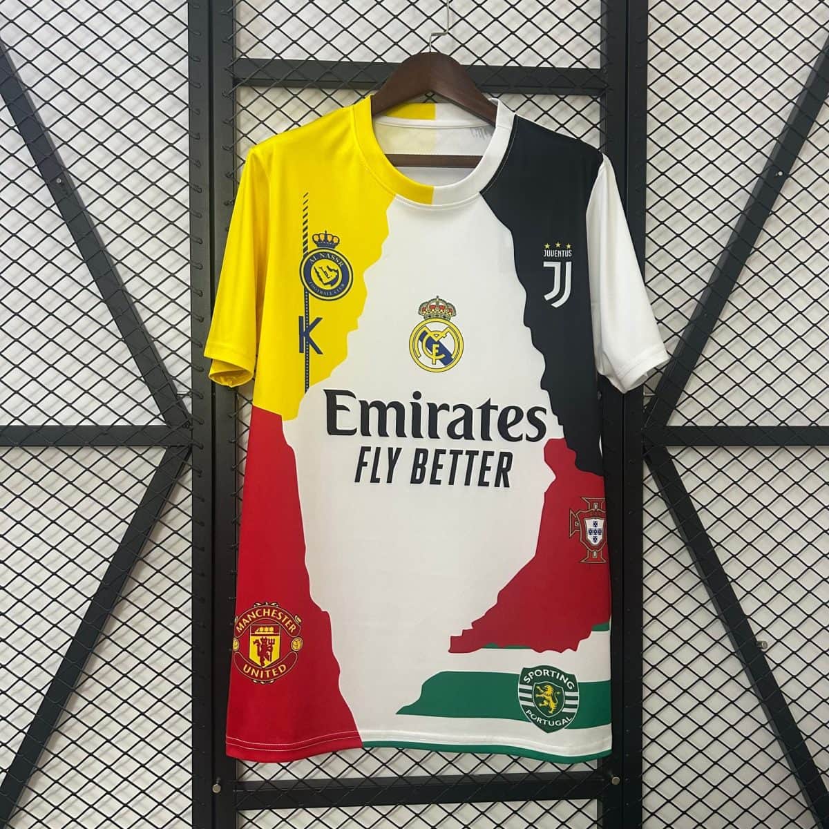 Color-blocked football jersey on a hanger featuring club crests (Juventus, Real Madrid, Manchester United, Sporting CP) against a metal grid backdrop.
