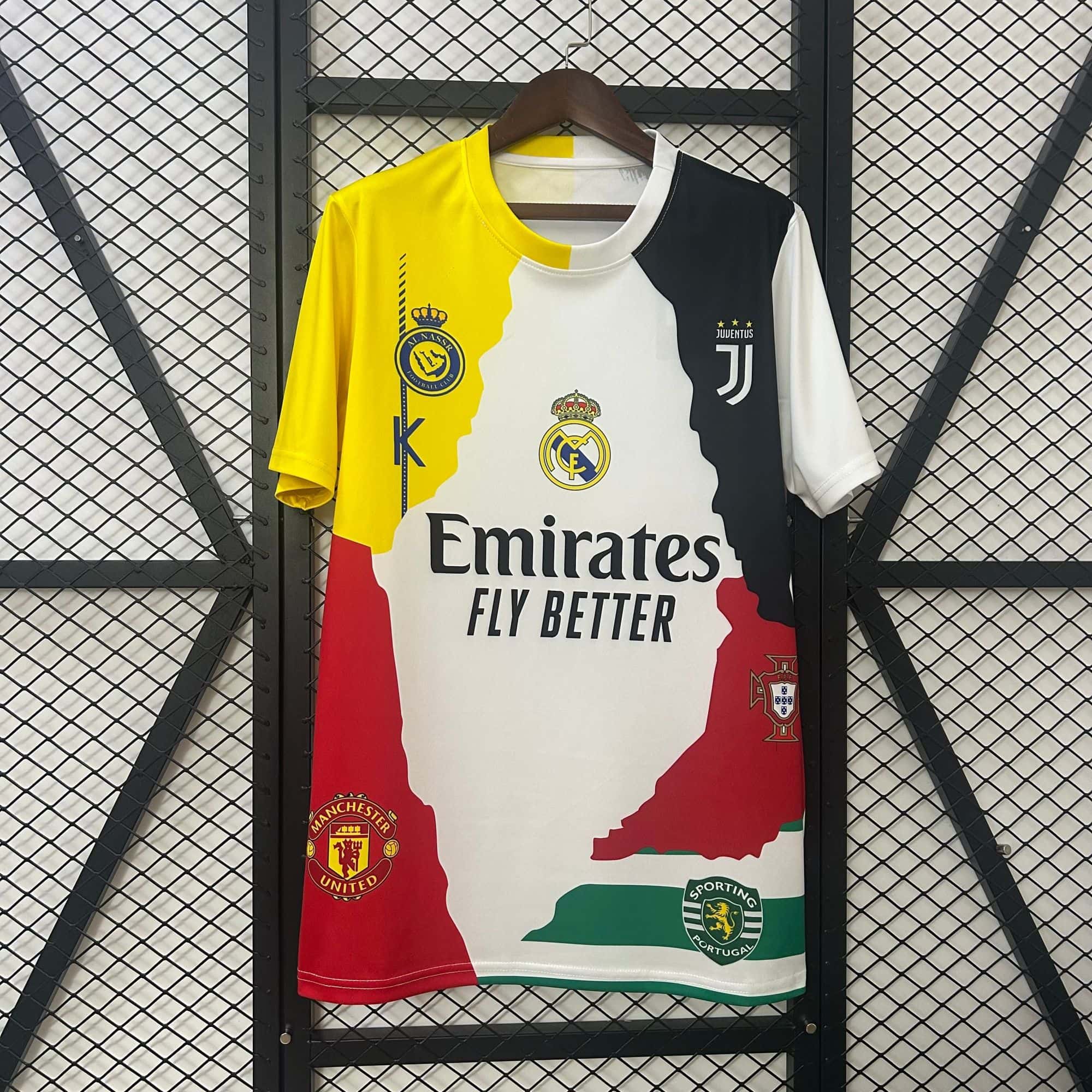 c805e474 | UAE SPORT STORE Color-blocked football jersey on a hanger featuring club crests (Juventus, Real Madrid, Manchester United, Sporting CP) against a metal grid backdrop.