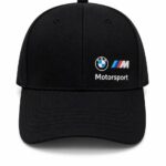 Black baseball cap with a curved brim featuring BMW Motorsport logo on the front panel.
