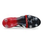 c8cf5e7ae702 | UAE SPORT STORE Close-up of a Predator football boot: red toe, black body, red strap, and studded sole visible