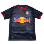 Dark blue Red Bull soccer jersey with a large Red Bull logo on the front over a yellow circle, team crest on the left chest, Puma logo on the right, and red trim on the collar and sleeves.