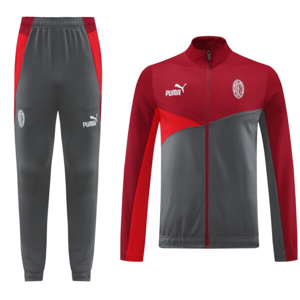 Milan football tracksuit: gray pants with red side panels and Puma logo, plus a red-gray zip jacket with club crest on the chest.