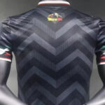 c9406c48ca4c24f7 | UAE SPORT STORE Back view of a navy chevron-pattern sports jersey with dark zigzag stripes; small colorful Dragon Ball logo appears near the upper back.