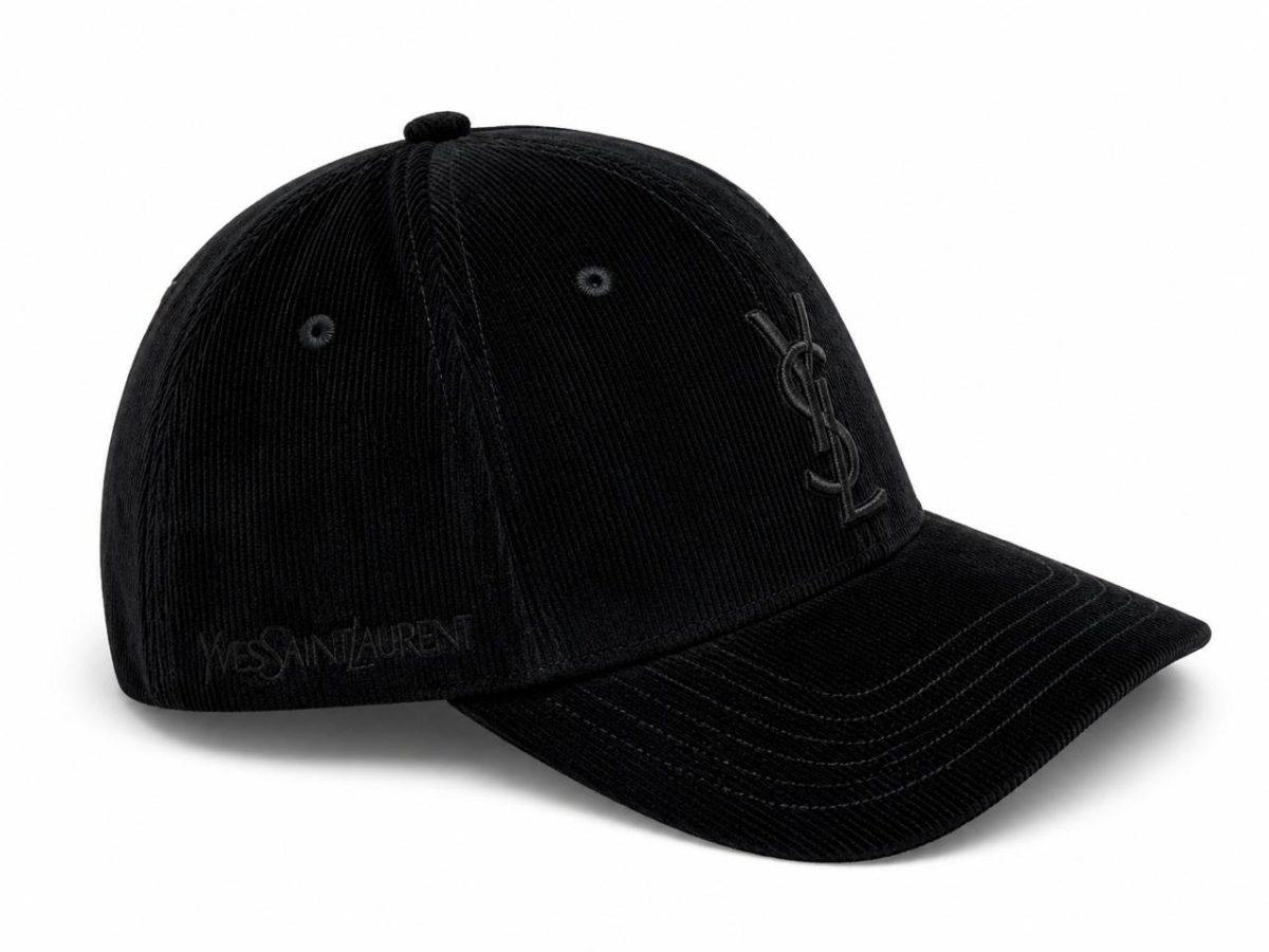 Black corduroy baseball cap with a tonal YSL logo on the front panel and Yves Saint Laurent embossed along the side edge.