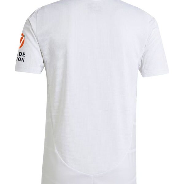 Back view of a white short-sleeve sports jersey with a curved hem, subtle mesh texture, an orange circular logo on the left sleeve, and small logo text at the neck area.