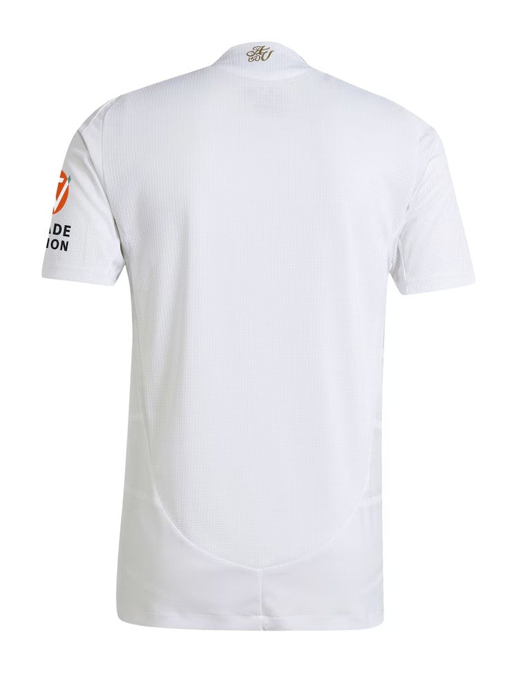 cZ9IS8uFNusQ4ij | UAE SPORT STORE Back view of a white short-sleeve sports jersey with a curved hem, subtle mesh texture, an orange circular logo on the left sleeve, and small logo text at the neck area.