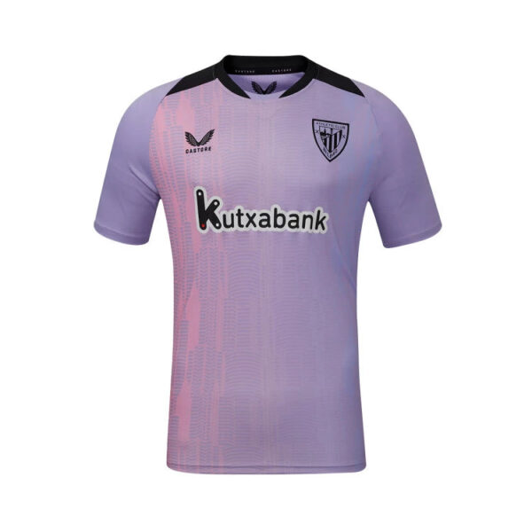 Purple soccer jersey with black collar and pink vertical pattern, featuring Kutxabank sponsor and team crest on the chest.